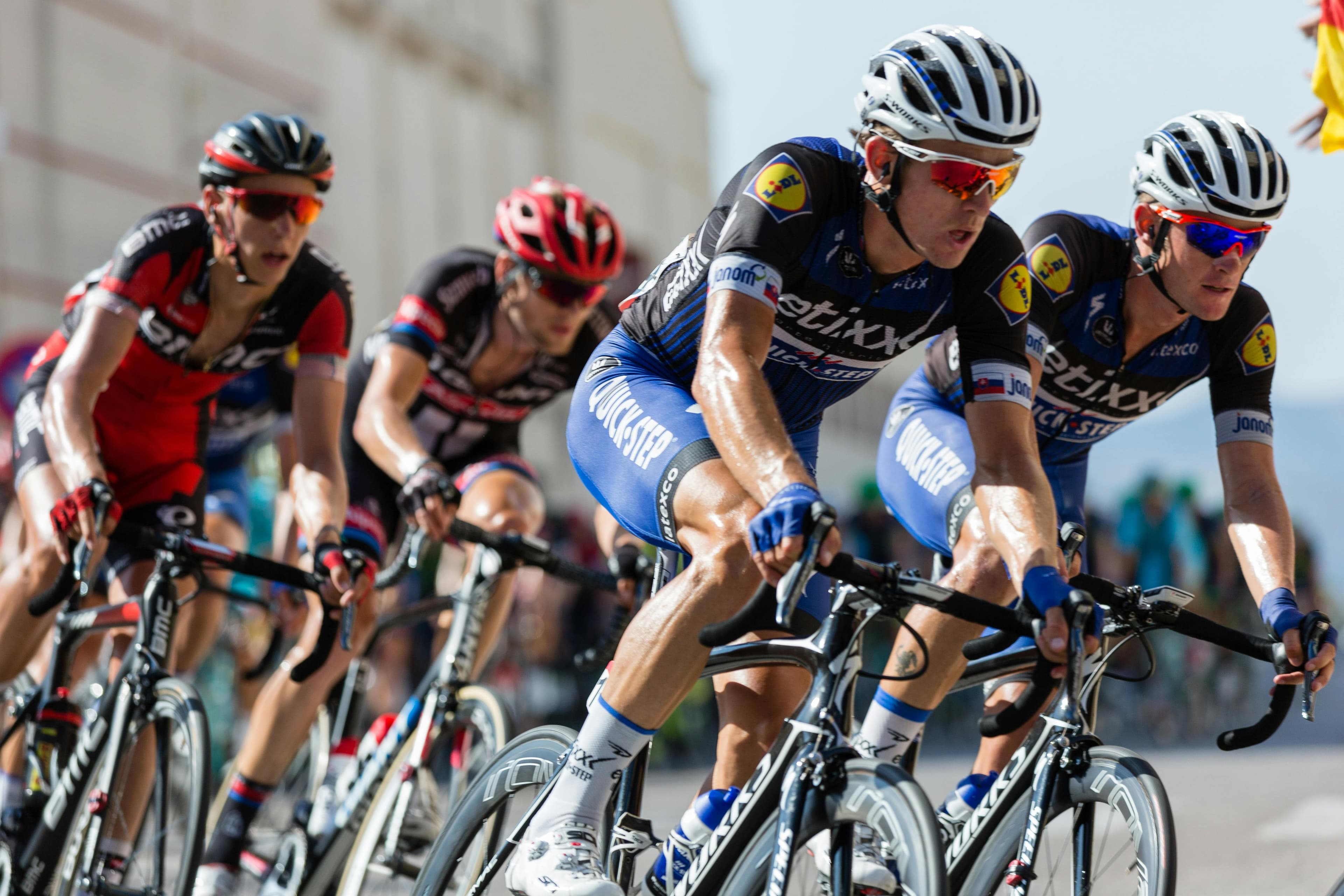 Hero image of cyclists racing